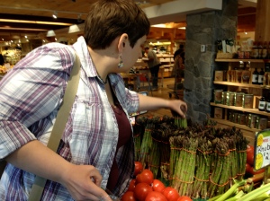 H discerning among the TONS of asparagus at Atkins Market in Amherst